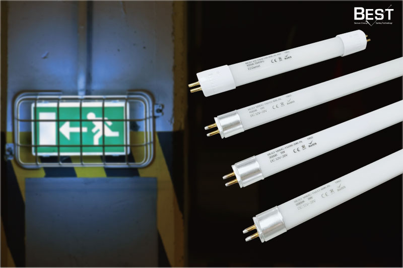 What are self-contained emergency lights and central battery emergency lights?